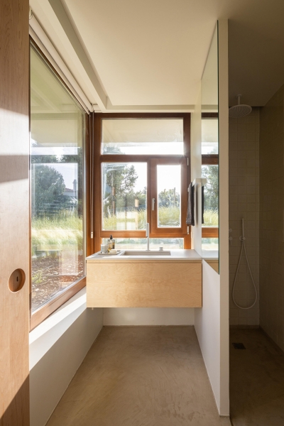 Blending Into Nature: A Half-Buried House With A Green Roof