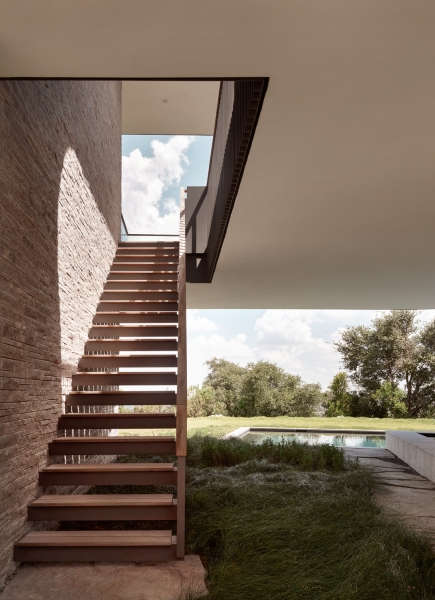 A bridge entry sets up the big reveal inside this home