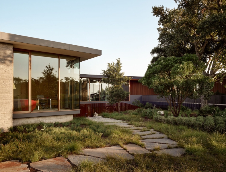 A bridge entry sets up the big reveal inside this home