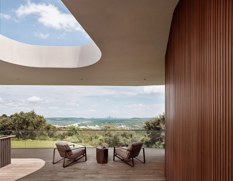 A bridge entry sets up the big reveal inside this home