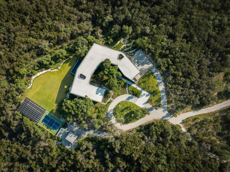 A bridge entry sets up the big reveal inside this home
