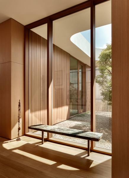 A bridge entry sets up the big reveal inside this home
