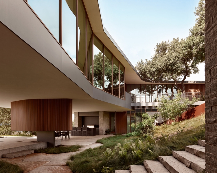 A bridge entry sets up the big reveal inside this home