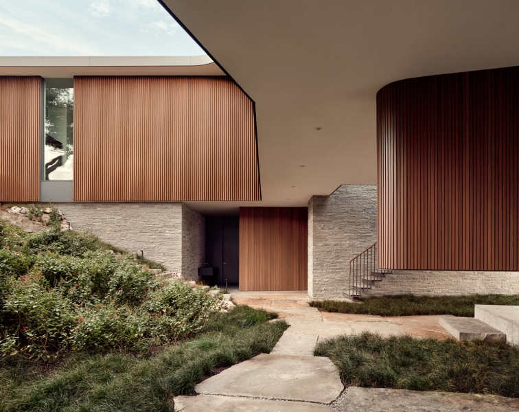 A bridge entry sets up the big reveal inside this home