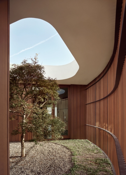 A bridge entry sets up the big reveal inside this home