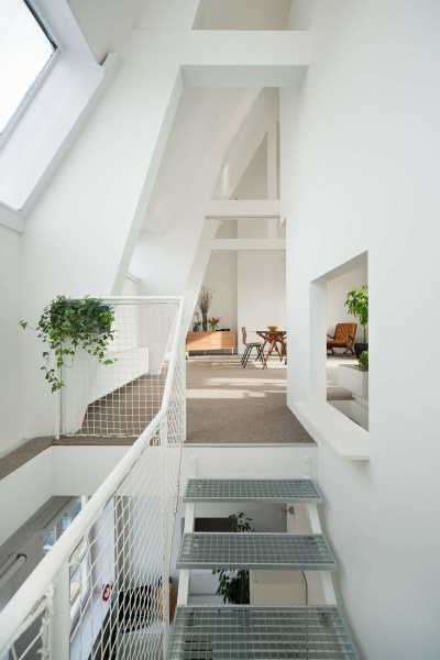 A Sunken Kitchen and Lofted Play Area Reinvented This Apartment