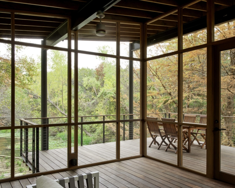 Floating over a creek, this elevated hideaway turns the forest into a living room