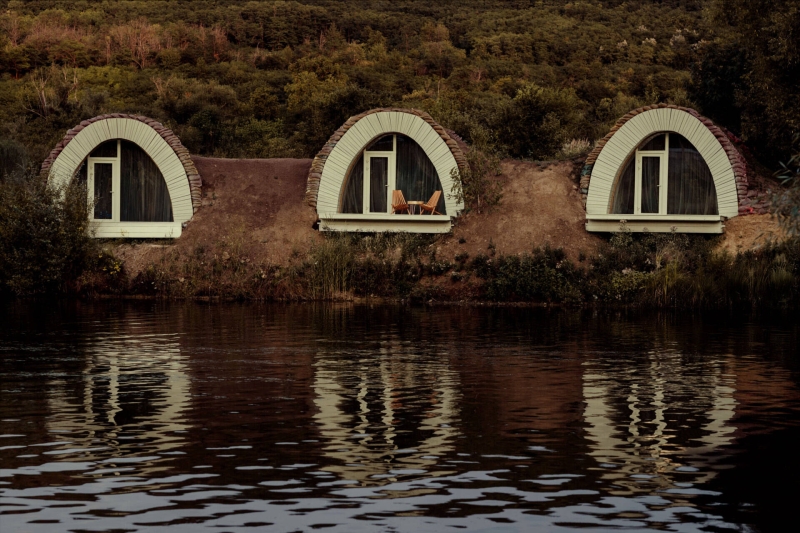 Hobbit houses by the water that look straight out of a story