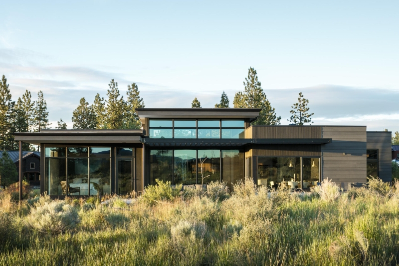 This modern home glows from within as night falls