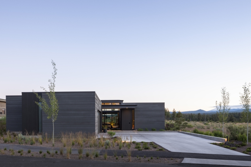 This modern home glows from within as night falls