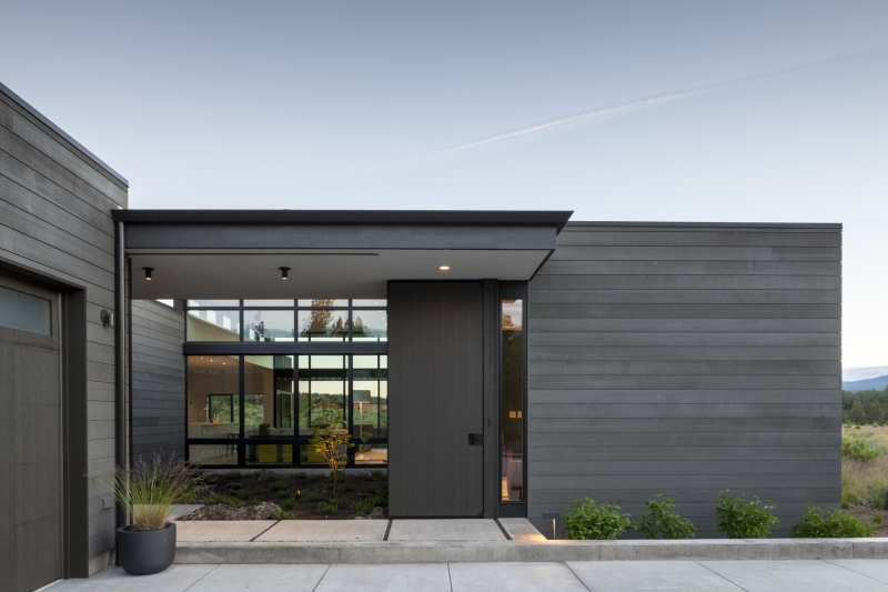 This modern home glows from within as night falls