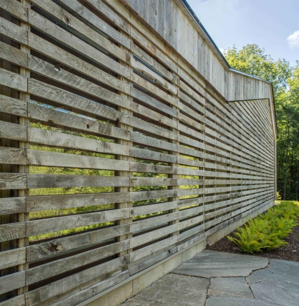 A House Built From Reclaimed Fence Wood: How Weathered Boards Create Instant Character