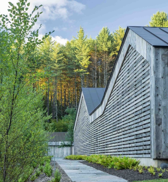 A House Built From Reclaimed Fence Wood: How Weathered Boards Create Instant Character