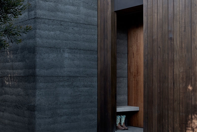 A slow living cabin where fold-out walls transform the space from studio to home