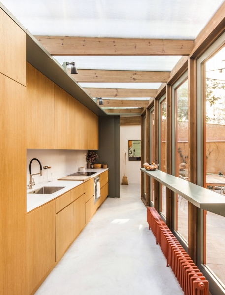 A sunlit kitchen addition that blurs indoors and outdoors