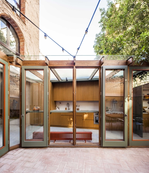 A sunlit kitchen addition that blurs indoors and outdoors