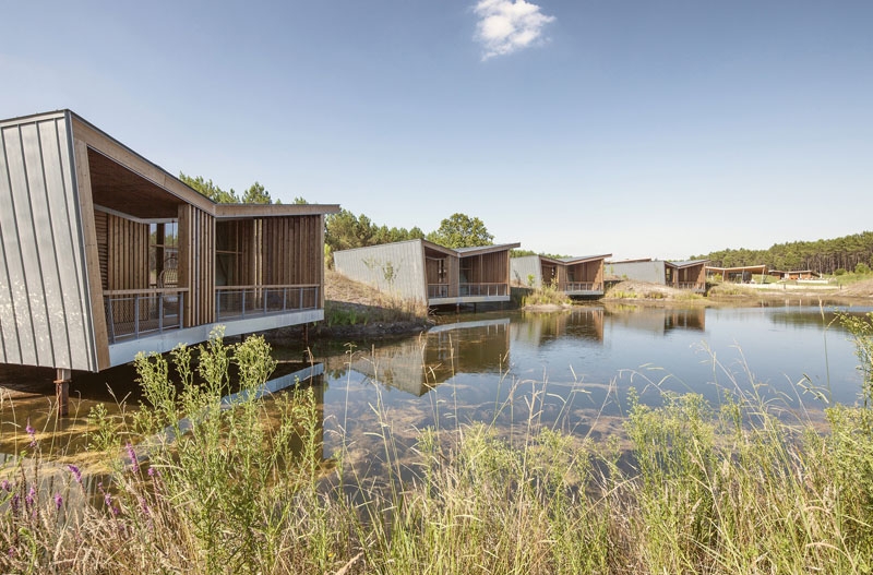 At Night, These Wood Cabins Glow Like Lanterns