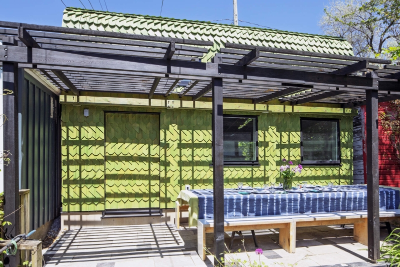 Dragon-Inspired Wood Shingles Cover This Laneway Garage