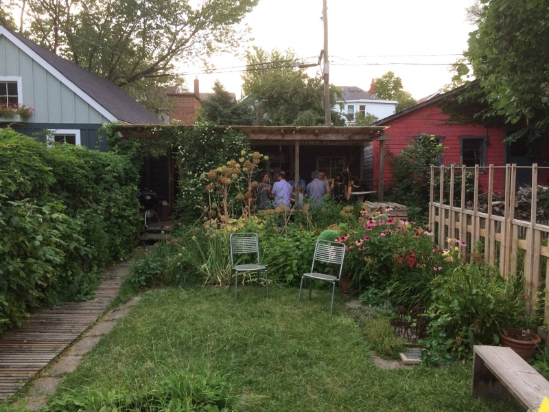 Dragon-Inspired Wood Shingles Cover This Laneway Garage