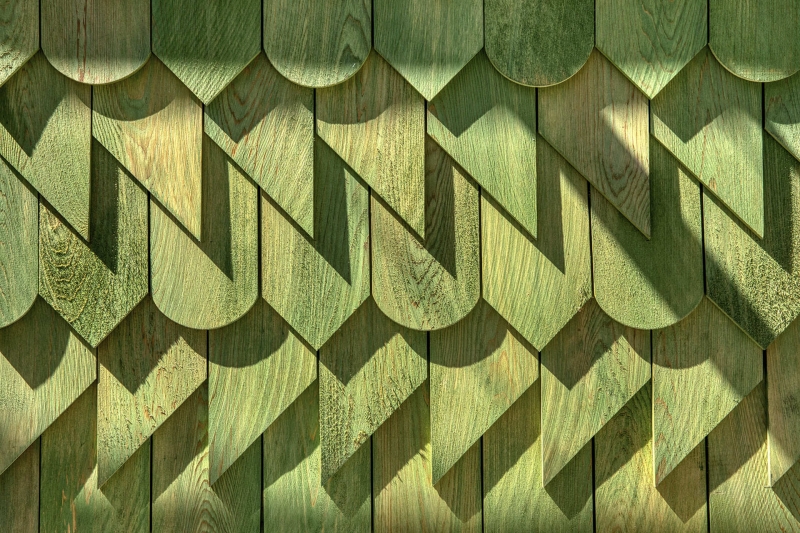 Dragon-Inspired Wood Shingles Cover This Laneway Garage