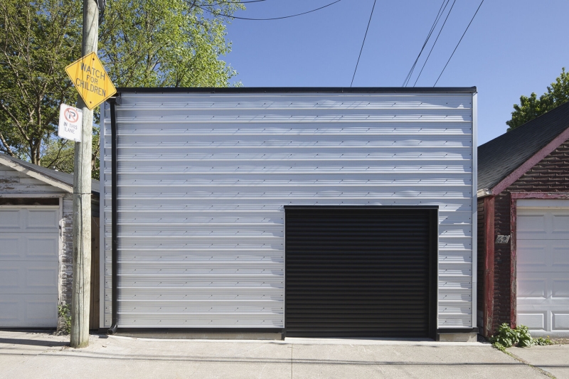 Dragon-Inspired Wood Shingles Cover This Laneway Garage