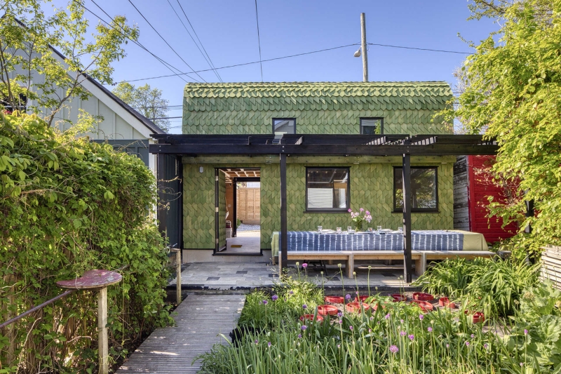 Dragon-Inspired Wood Shingles Cover This Laneway Garage