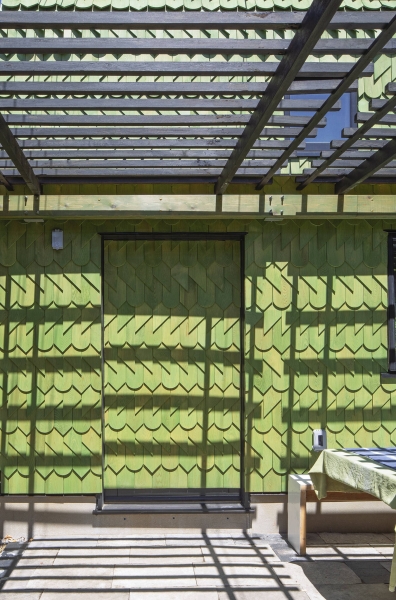 Dragon-Inspired Wood Shingles Cover This Laneway Garage
