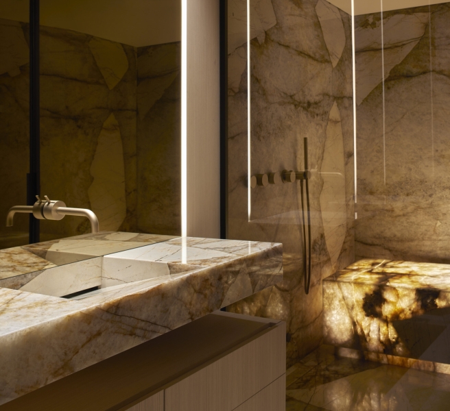 Inside a modern villa wrapped in stone walls