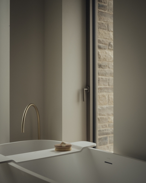 Inside A Stone House That Follows the Land