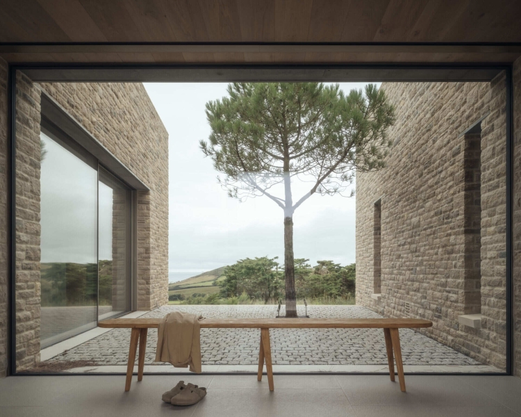 Inside A Stone House That Follows the Land