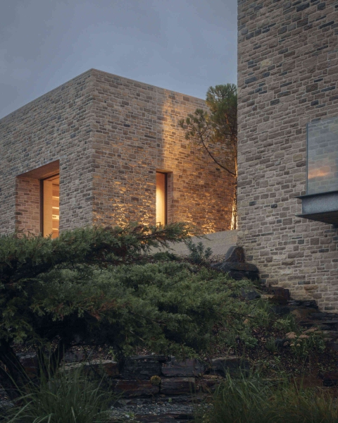 Inside A Stone House That Follows the Land