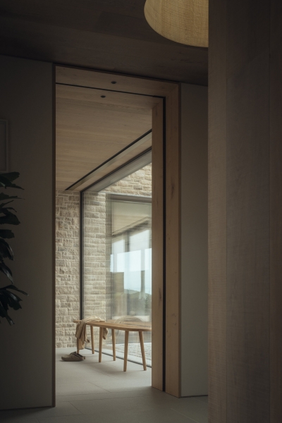 Inside A Stone House That Follows the Land