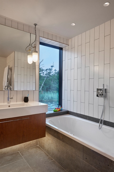 Inspired by Boat Sheds and Covered in Wood Shingles, This House Feels Surprisingly Modern
