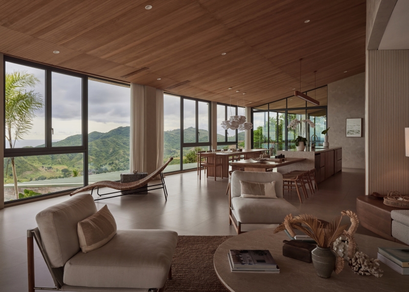 The mountain appears to be slowly consuming this modern home