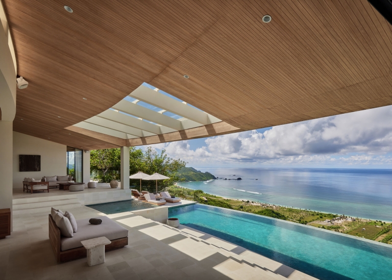 The mountain appears to be slowly consuming this modern home
