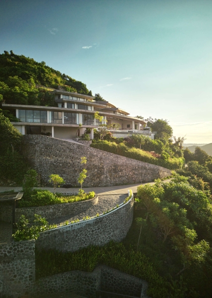 The mountain appears to be slowly consuming this modern home
