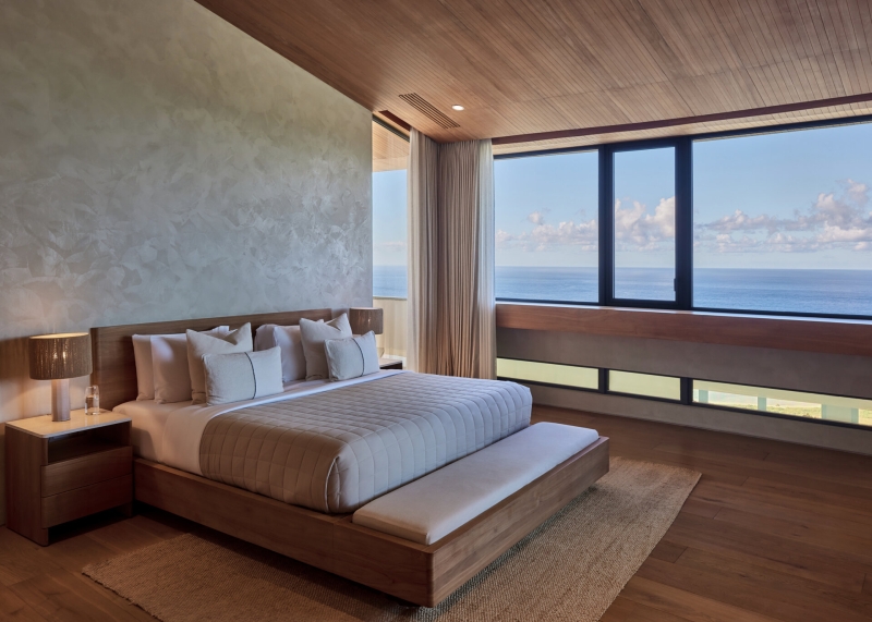 The mountain appears to be slowly consuming this modern home