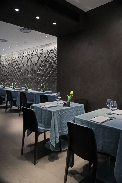 The Story Behind Olivo’s Striking Stone Tapestry Walls