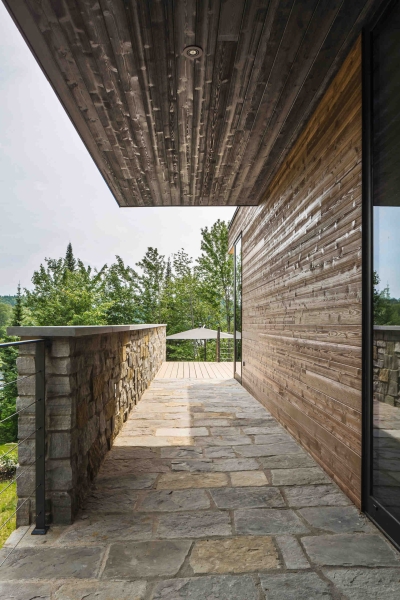 This Terraced House Reuses Excavated Stone for the Landscape