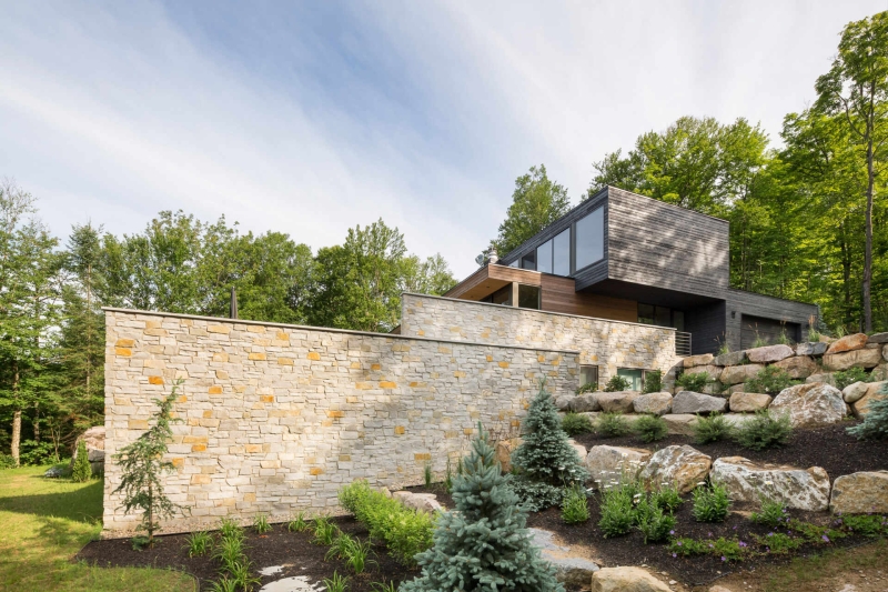 This Terraced House Reuses Excavated Stone for the Landscape
