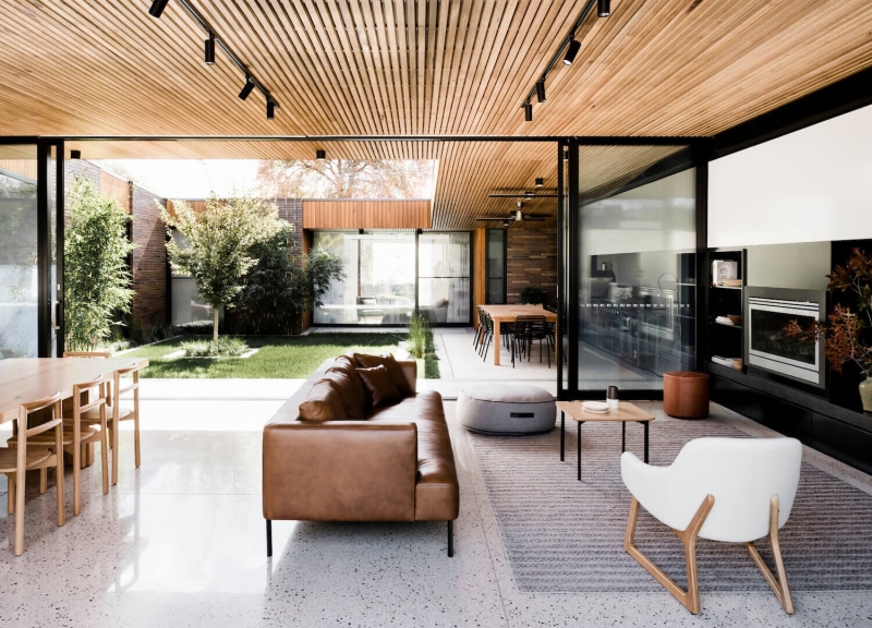 A Dark Brick Exterior Hides A Light-Filled Courtyard Inside This Home