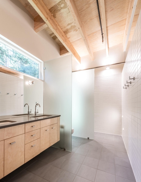 Hidden in the woods: a sleek riverfront escape designed for peace and privacy