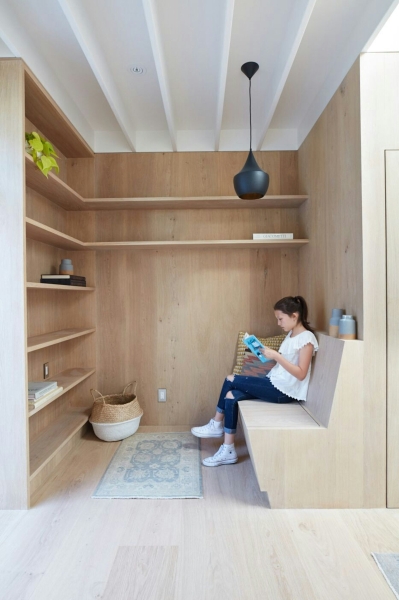 How a Small Carriage House Became a Serene Creative Space With A Reading Nook