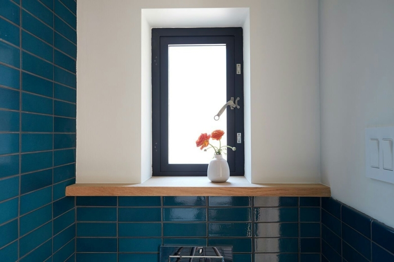 How a Small Carriage House Became a Serene Creative Space With A Reading Nook