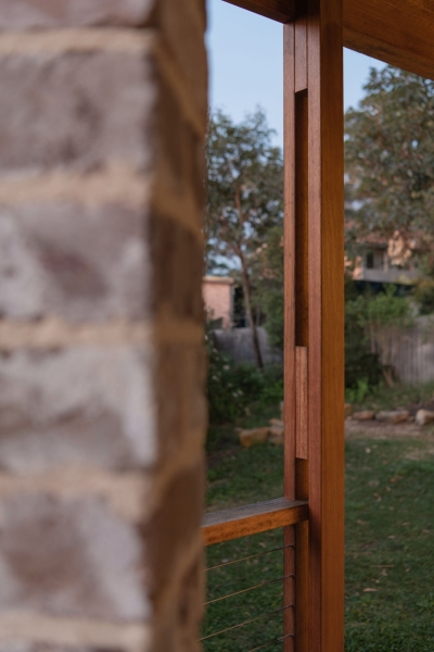 Inside the wraparound porch home glowing at golden hour