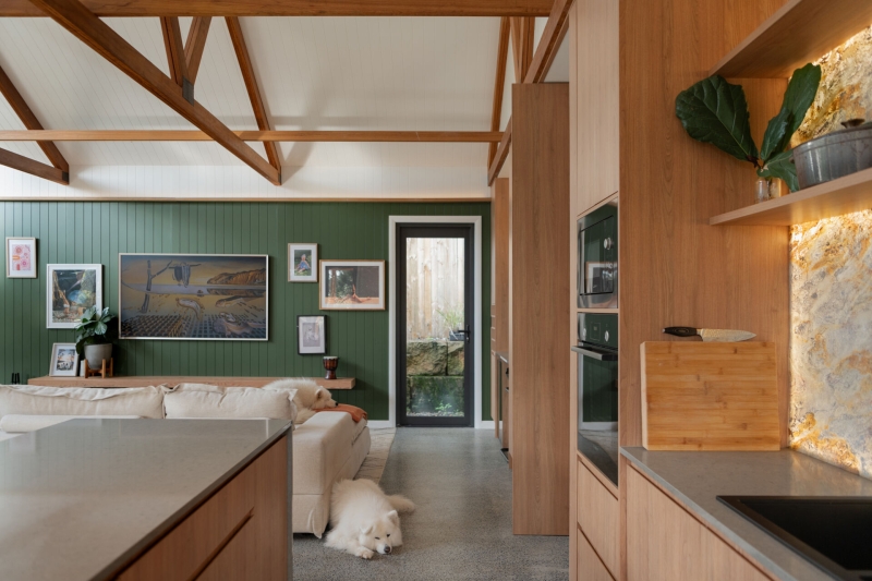 Inside the wraparound porch home glowing at golden hour
