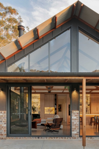 Inside the wraparound porch home glowing at golden hour