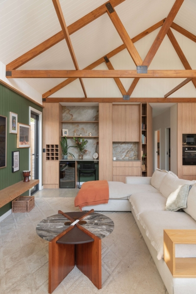 Inside the wraparound porch home glowing at golden hour