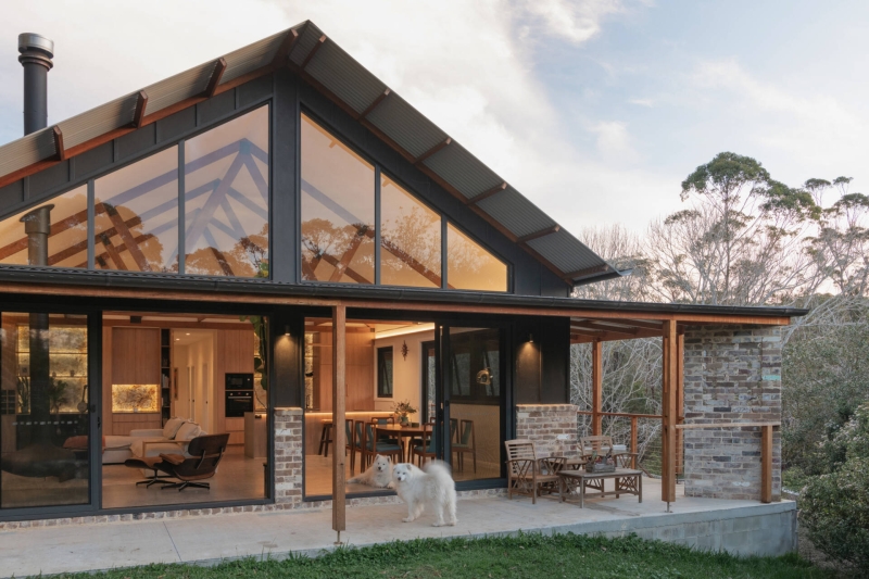 Inside the wraparound porch home glowing at golden hour