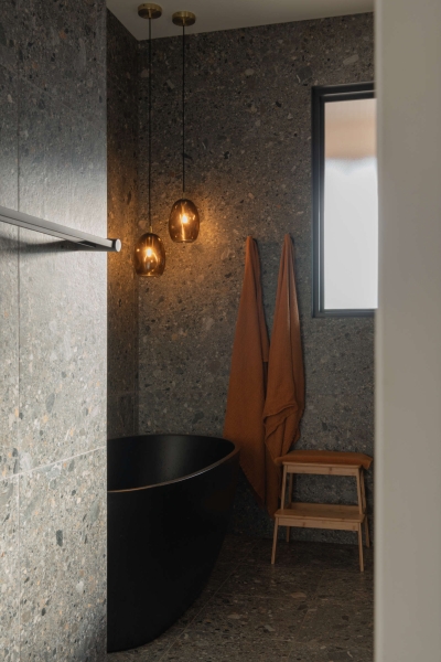 Inside the wraparound porch home glowing at golden hour